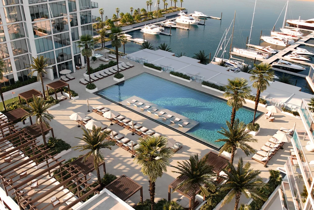 Aerial view of Marina Pointe showcasing new construction waterfront condos for sale in Tampa's Westshore Marina District, featuring modern architecture, luxury interiors, and resort-style amenities including a large outdoor pool and deepwater marina access.