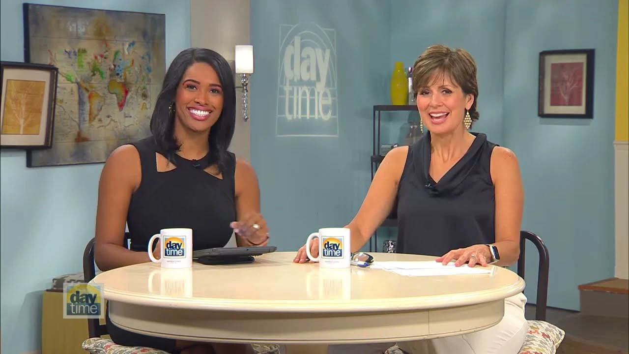 Talk show hosts discussing the Marina Pointe lifestyle