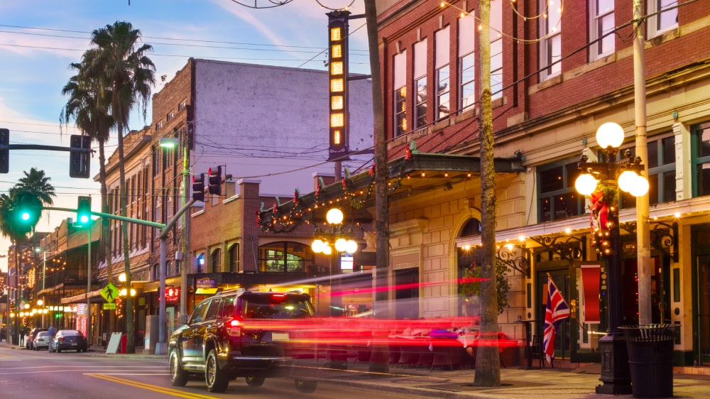 Evening street view of historic City in Tampa with lights and restaurants