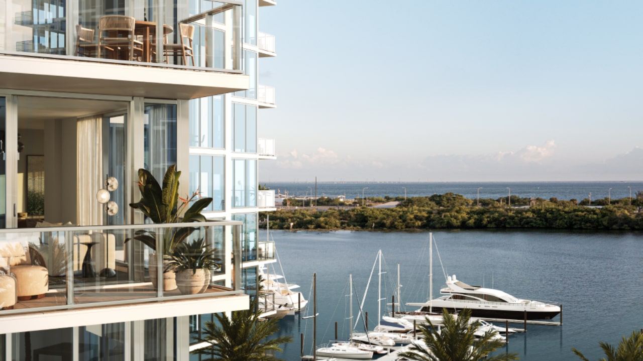 Modern Marina Pointe balcony with plants and outdoor seating overlooking yachts and Tampa Bay