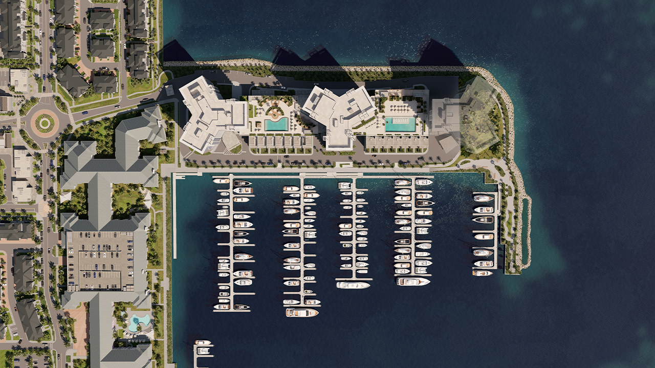 Aerial view of Luna at Marina Pointe showcasing waterfront residences and a full-service marina.