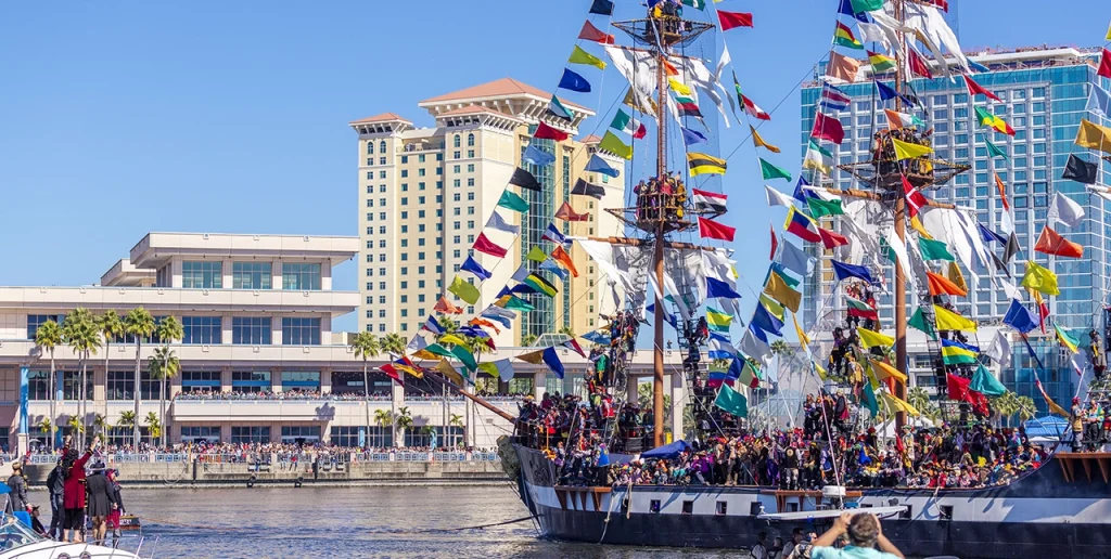 Tall ship decorated with flags during Gasparilla in downtown Tampa