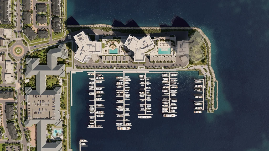 aerial, marina, boats, docks, waterfront, buildings, residential, coastline, harbor, development Aerial view of marina with boats and surrounding residential buildings